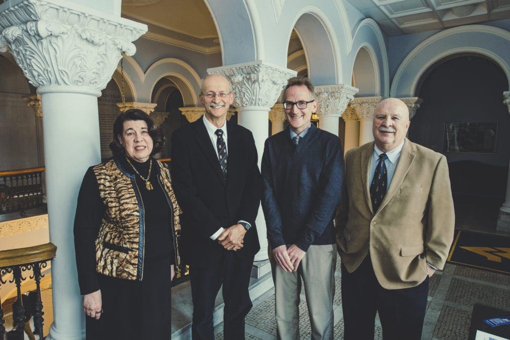 Benedum Scholars Janice Spleth, Bernard Schreurs, Duncan Lorimer and Peter Schaeffer pose for a group shot on the second floor of Stewart Hall March 5th, 2019.
