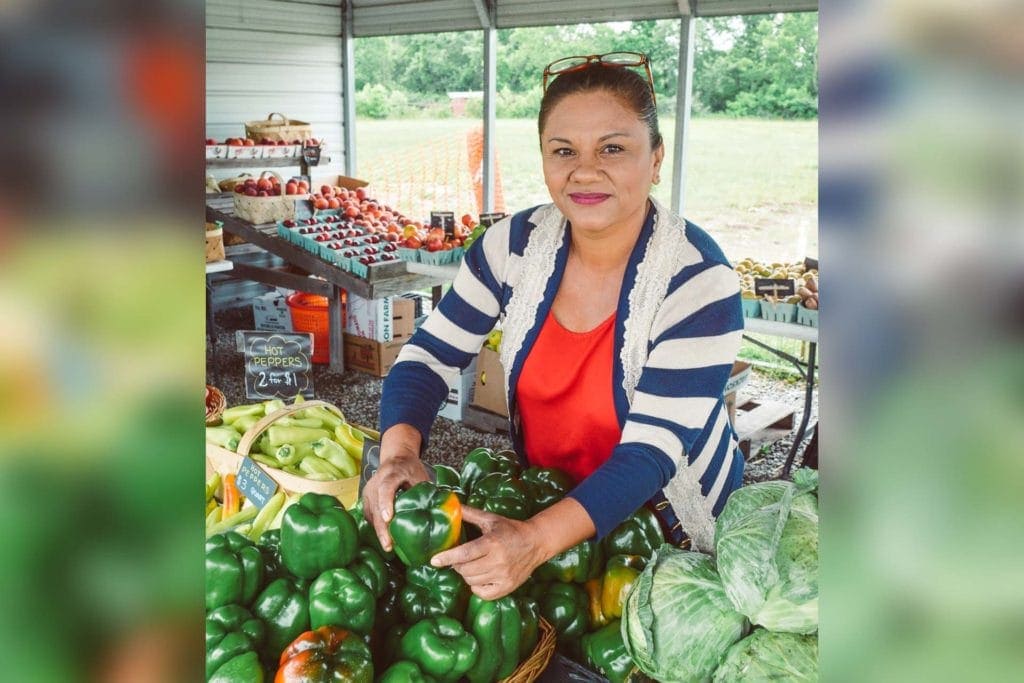 Pati Espinosa, who owns Green Acres Farm and Greenhouses with husband Lupi and children Diego and Cristal, shows some of the delicious peppers they grow and stock in their produce stands, like the one located at 32 N. Locust St. in Buckhannon, across from Sheetz.