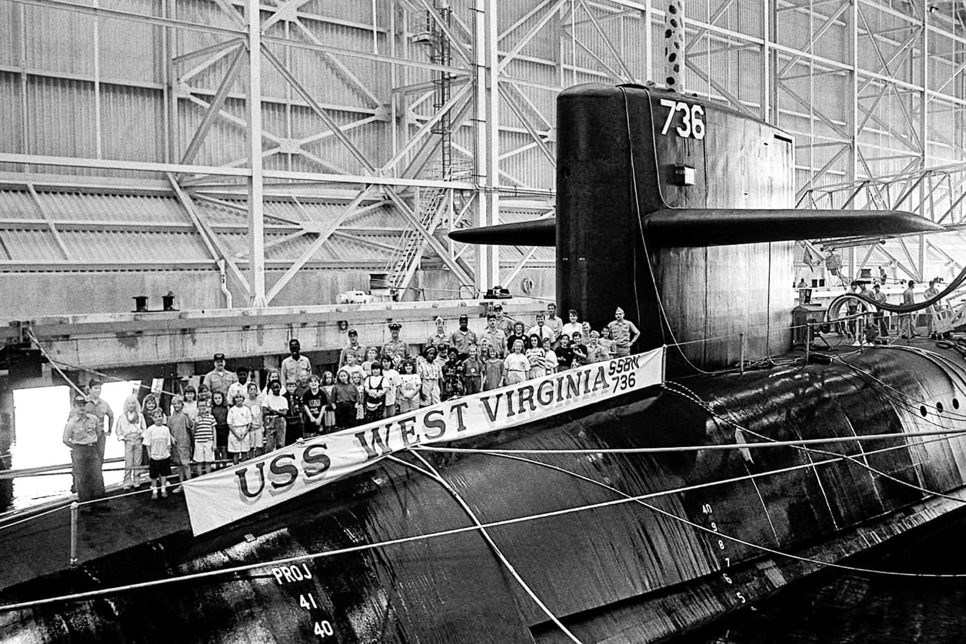 Fourth and fifth grade honor students from the Matilda Harris Elementary School pose for a photograph on deck with gold crew members of the nuclear-powered strategic missile submarine West Virginia (SSBN-736), 18 Sep 1991. The students are being treated to an hour-long tour of the vessel.