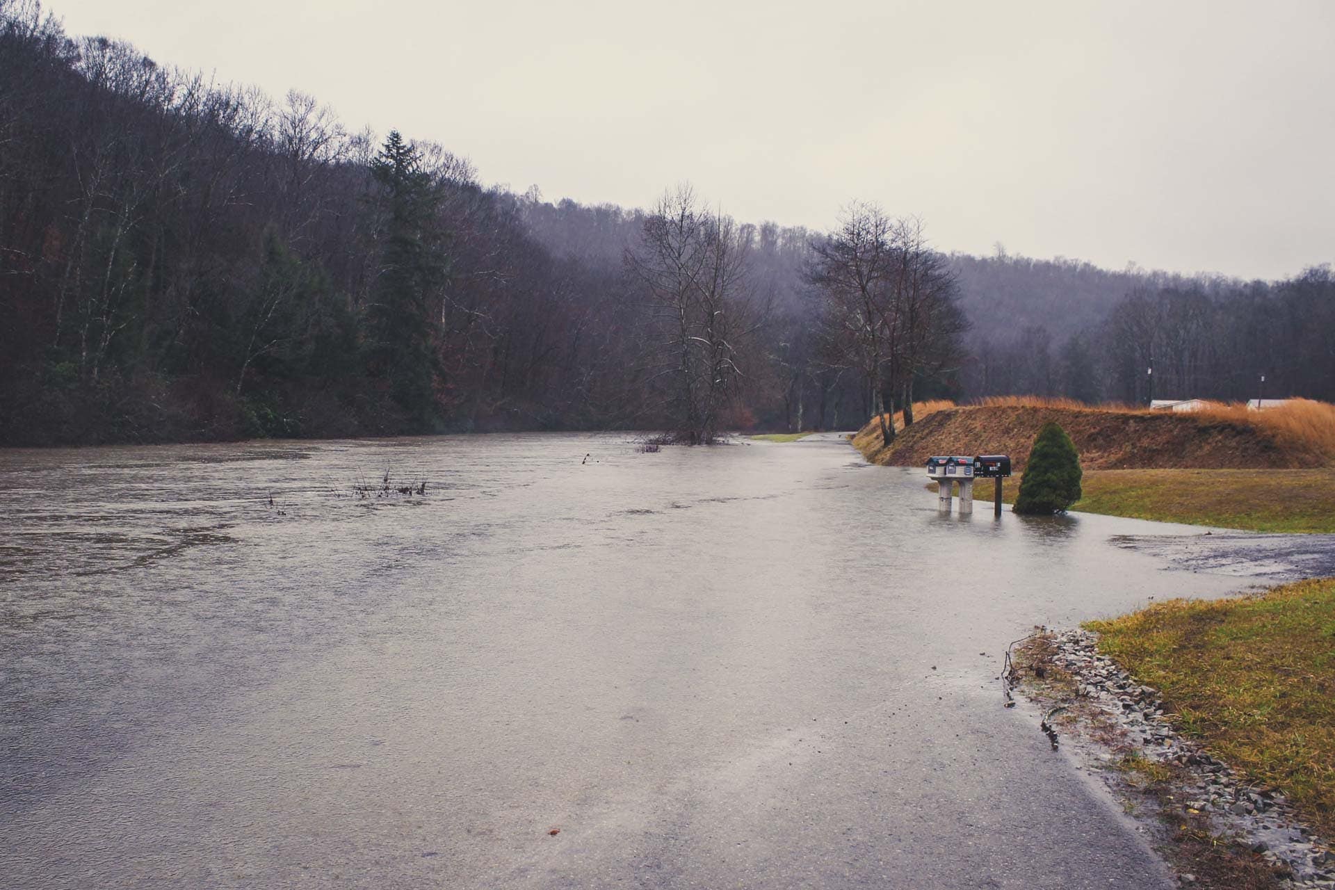 The Middle Fork River covers part of Boy Scout Camp Road, just off of Route 33, Tuesday morning.