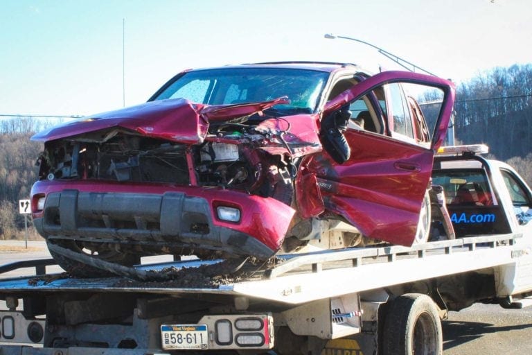 A red Chevrolet Trailblazer suffered heavy damage after being hit by a tractor trailer at the intersection of Route 33 and Brushy Fork Road Monday afternoon.