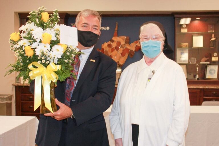 Skip Gjolberg, President of St. Joseph’s Hospital, honors Sister Francesca Lowis, SAC at a celebration of her 60th Jubilee.