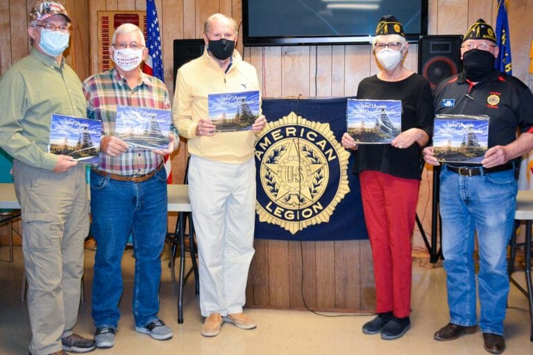 Pictured, from left, are Band of Brothers members John Simons, Kevin Hawkins and Al Tucker, American Legion Post 7 post adjutant Mary Albaugh and Post 7 post commander Ed Smith.