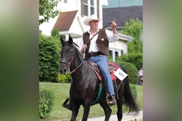 Virgil Miller trots down Kanawha Street during a previous Strawberry Festival Horse and Carriage Parade. Miller returns as the Upshur County Sheriff in January after being elected last month.