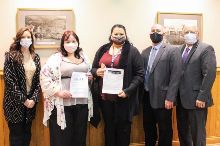 From left: Commission president Kristie Tenney; Alicia Bosely and Addie Helmick with Centers Against Violence; and commissioners Sam Nolte and Terry Cutright.