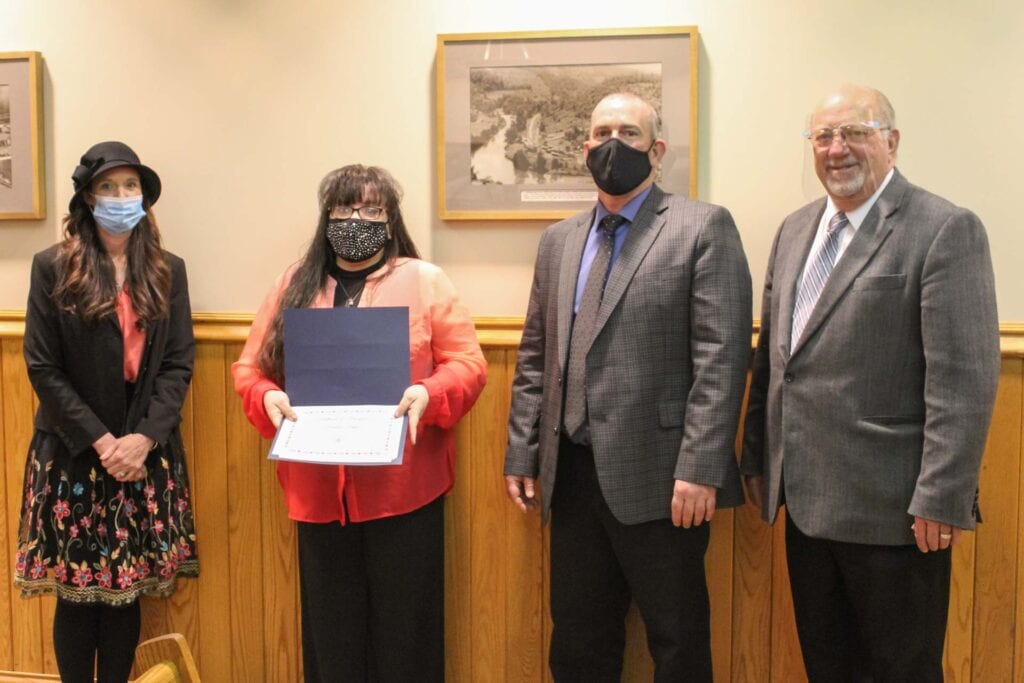 Prisilla Peggs, second from left, is recognized by Upshur County Commissioners Kristie Tenney, Sam Nolte and Terry Cutright.