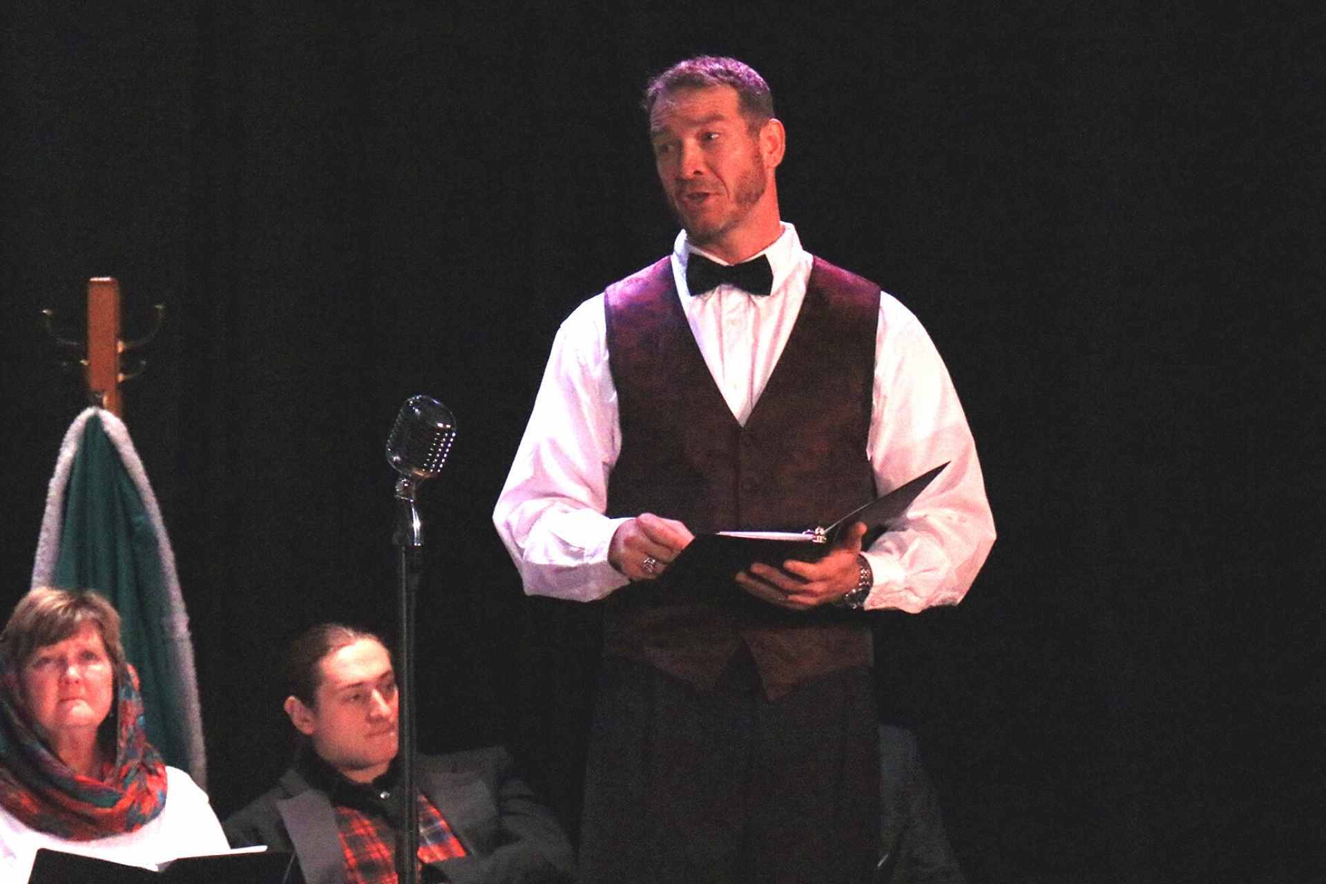 Glenville State College Assistant Professor of Criminal Justice Dr. Donal Hardin at the microphone at a previous reader’s theater production. The Glenville State College Players will perform Arthur Miller’s All My Sons at GSC, April 22-24.