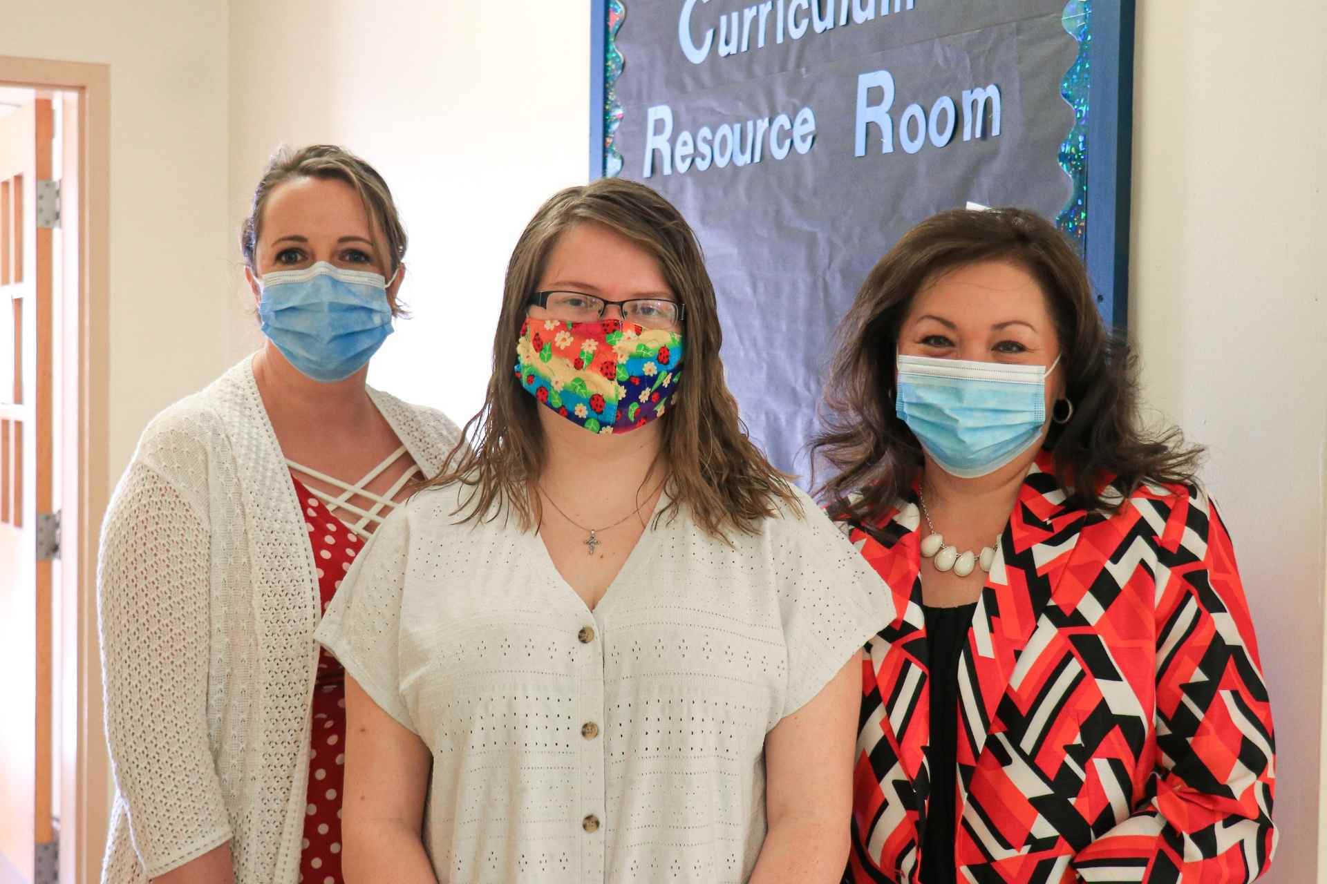 Dr. Shelly Ratliff, Morgan Golden, and Connie Stout O'Dell outside the recently opened Curriculum Resource Center at Glenville State College.