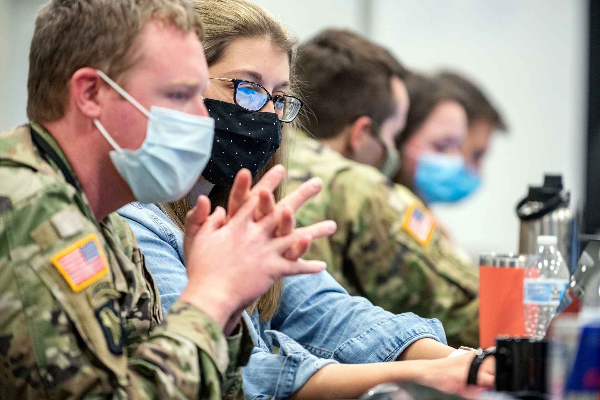 WVU computer science major Heather Fetty works with members on the West Virginia National Guard during Operation Locked Shield, an international cybersecurity training exercise. (WVU Photo/Brian Persinger)