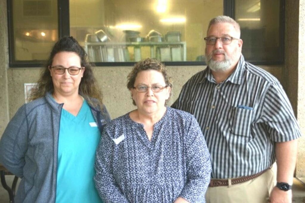 Long-time Mon Health Stonewall Jackson Memorial Hospital nursing employee Libby Brown (center) was honored with a reception on her retirement in June. Her family attended the event and is pictured with her -- daughter Joni Heater and husband Dwayne Brown. She has a stepson Mikel Brown who was unable to attend.