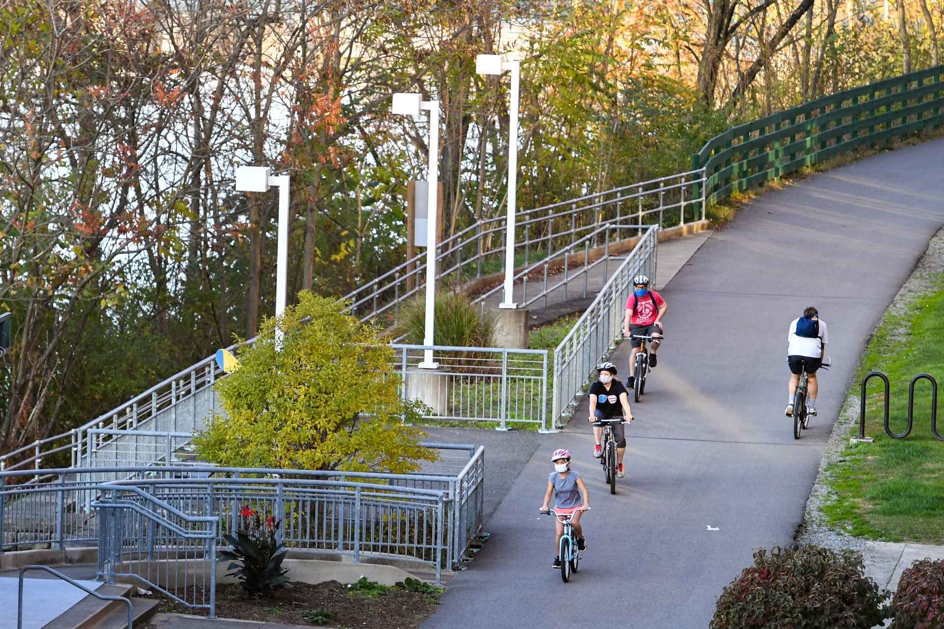 Cyclists take in some fresh air and exercise on the Rail Trail in Morgantown. (WVU Photo/Jennifer Shephard)