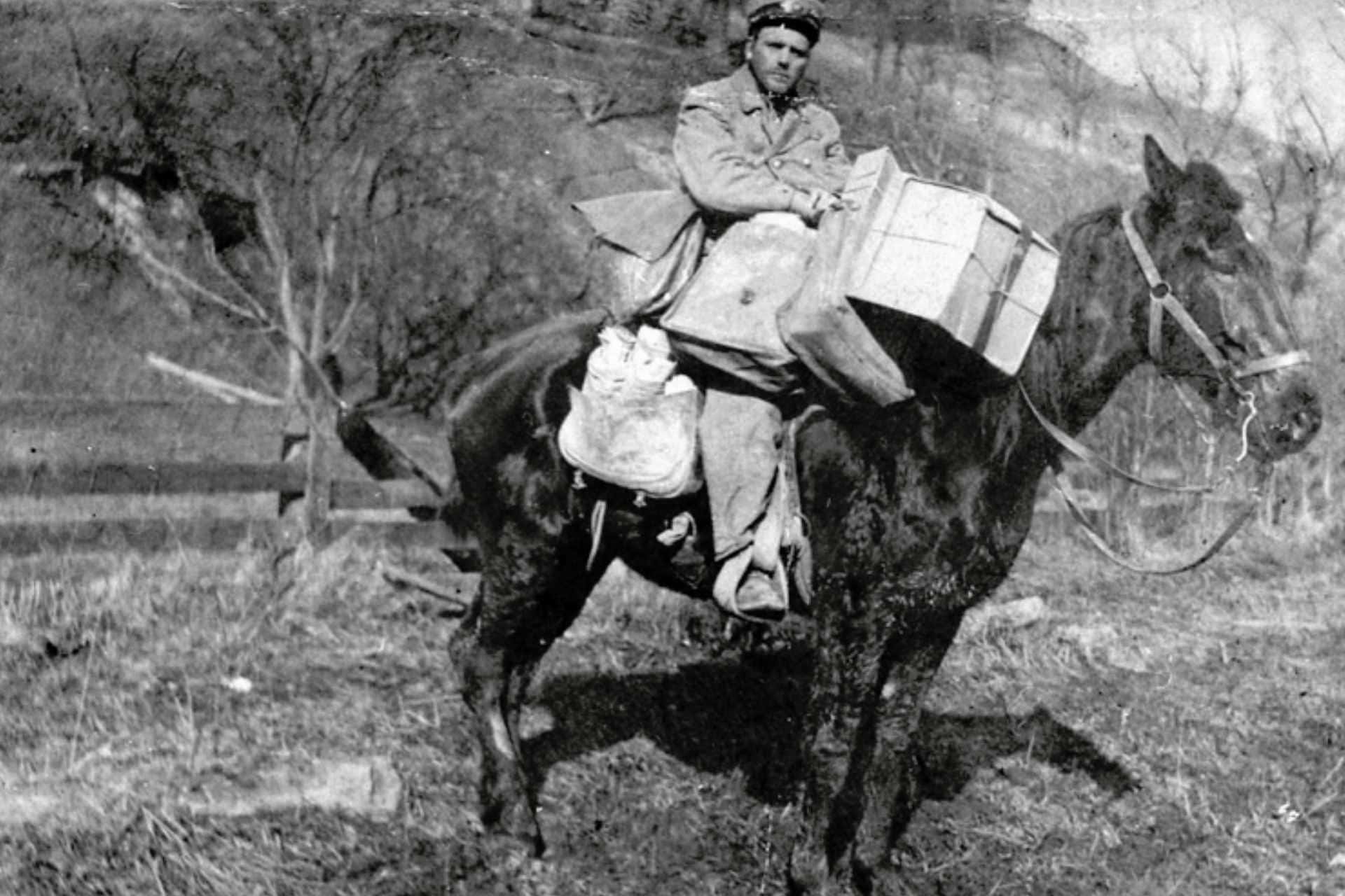 Rural mail delivery on horseback.