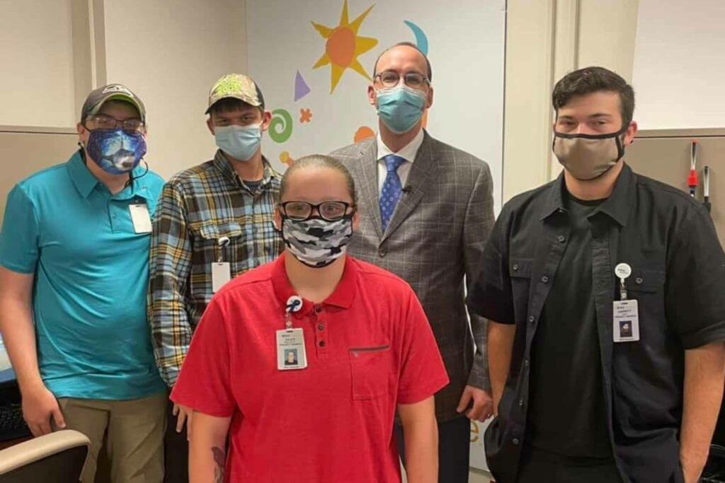 Albert L. Wright, Jr., president and CEO of the West Virginia University Health System (back row, 2nd from right), poses for a photo with the second cohort of Project SEARCH interns on their first day at WVU Medicine J.W. Ruby Memorial Hospital. The interns are (from left to right) Ben Chicchi, Justin Michael, Julianna “Jules” Heldreth, and Garritt Neel.