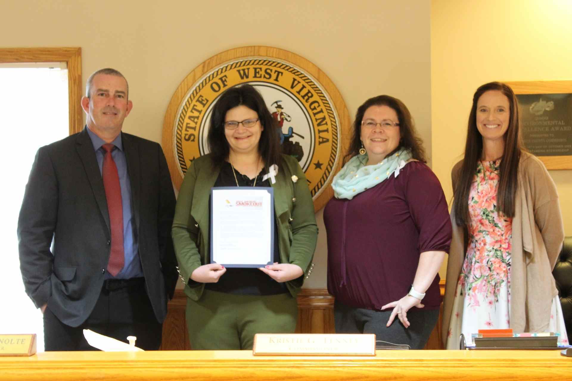 From left: Upshur County Commissioner Sam Nolte, Tobacco Prevention Coalition member Amanda Hayes, Family Resource Network director Lori Uldrich Harvey and Commissioner Kristie Tenney.