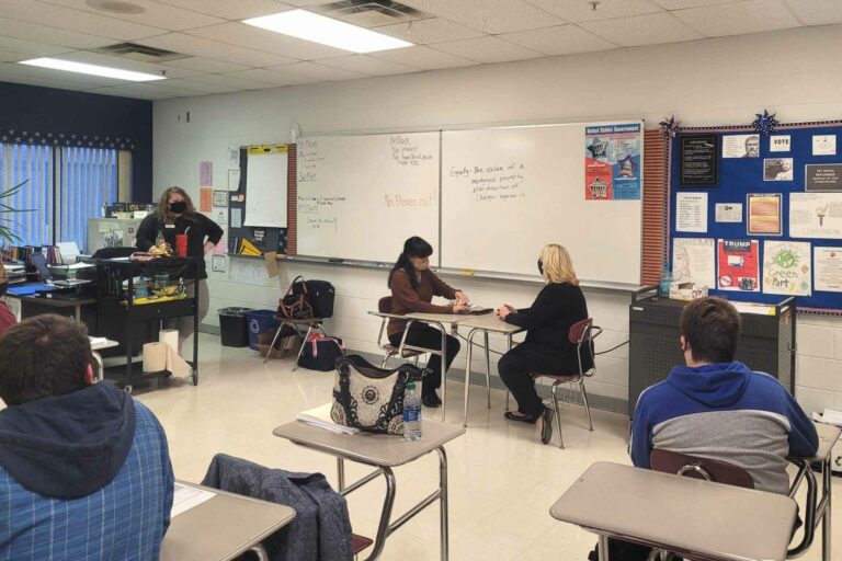 HOC’s home ownership advisor Jami Stewart, Freedom Bank manager Sherrie Cowgill (middle) and HOC’s loan originator (right) provide Elkins High School seniors on information about common banking procedures, loans, stocks/bonds and more.