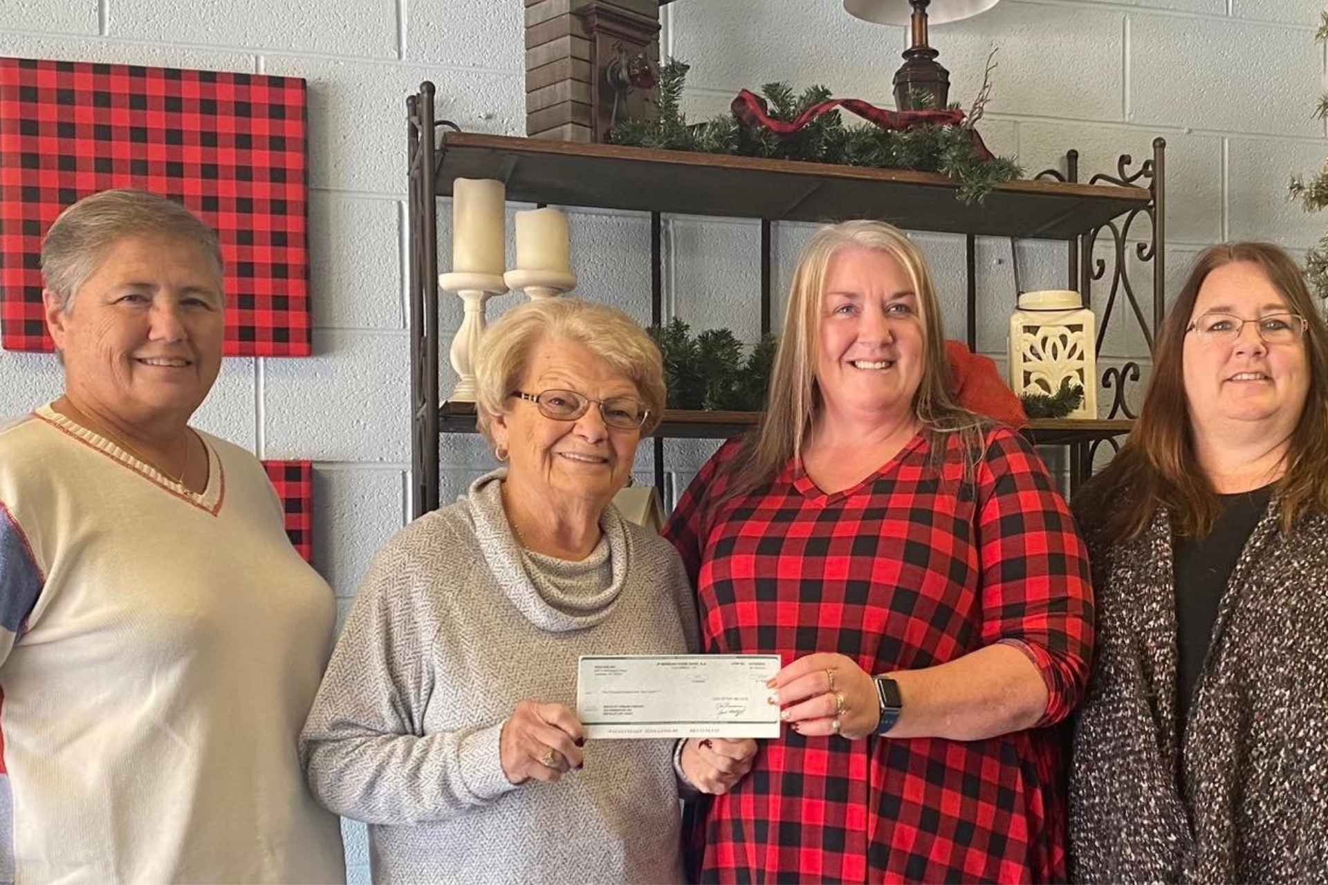 On November 22, 2021, ResCare Community Living of Beckley presented a $5,000 donation to Fishes and Loaves. Pictured: Marsha Smith (Fishes and Loaves), Shelby Warden (Fishes and Loaves), Terry Redden (ResCare), Cathy Redden (ResCare)