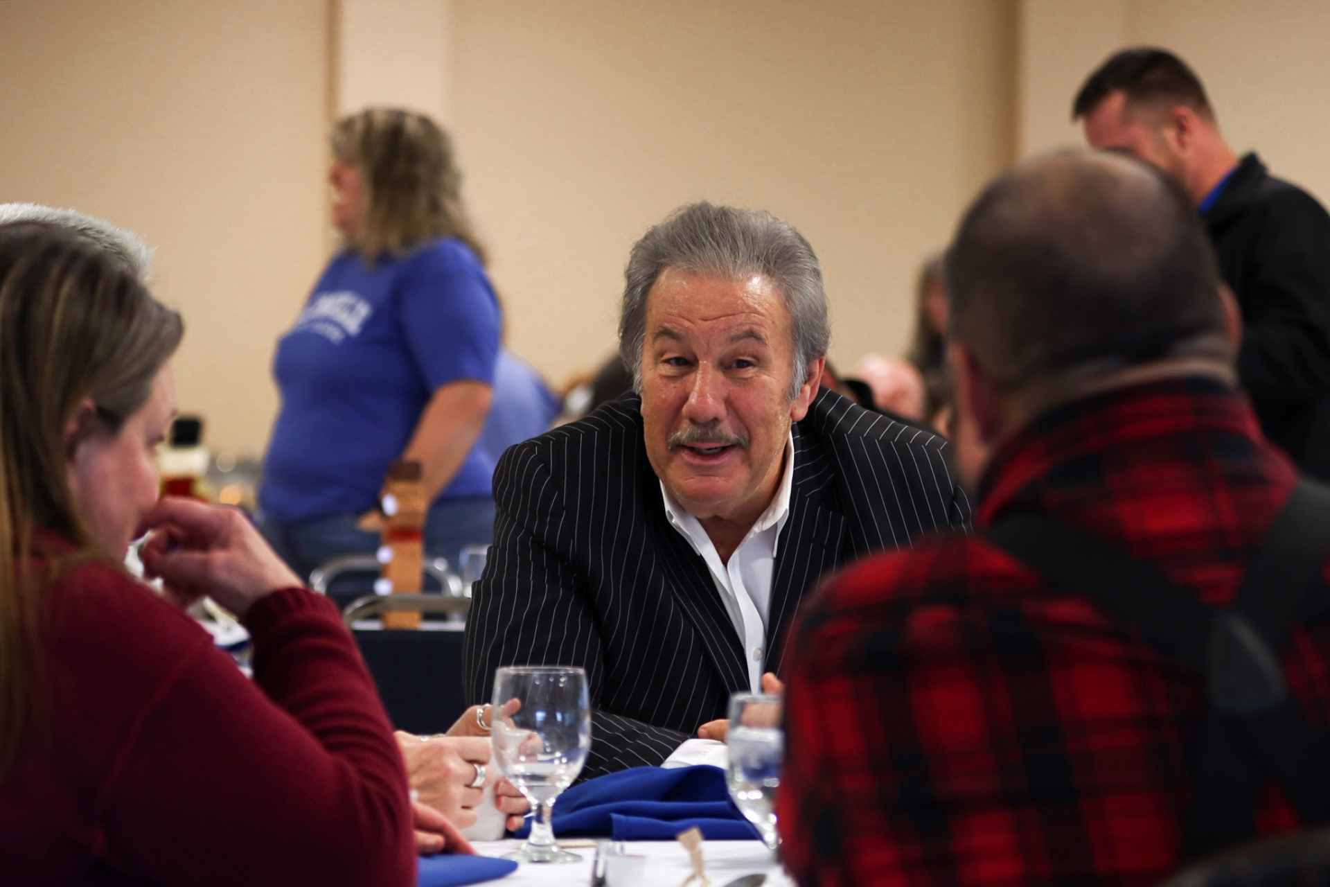 Glenville State College President Dr. Mark Manchin (center) chats with Associate Professor of English Dr. Melody Wise and Assistant Professor of Criminal Justice Dr. Jeff Bryson at the Holiday Luncheon.