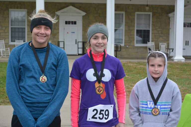 The top three female finishers in Mon Health SJMH Gobble Gallop on Thanksgiving were, left to right, first place Emily Louk, second place Audry Corrigan, and third place Georgia Lewis.