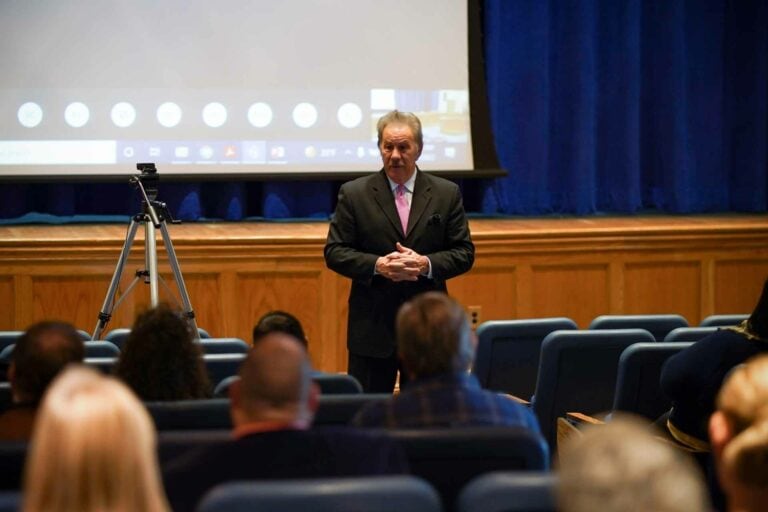 Glenville State College President Dr. Mark A. Manchin speaks to faculty and staff assembled for the annual opening meeting. The meeting is held prior the beginning of each semester and serves as an opportunity for employees to hear campus updates.