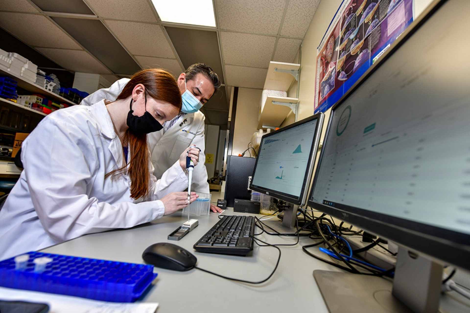 Emily Westemeier, a graduate student, sequences cancer tissue samples with Ivan Martinez, associate professor in the WVU School of Medicine. The University has been maintained its R1 status as a “very high research activity” institution, according to the Carnegie Classification of Institutions of Higher Education. (WVU Photo/Brian Persinger)