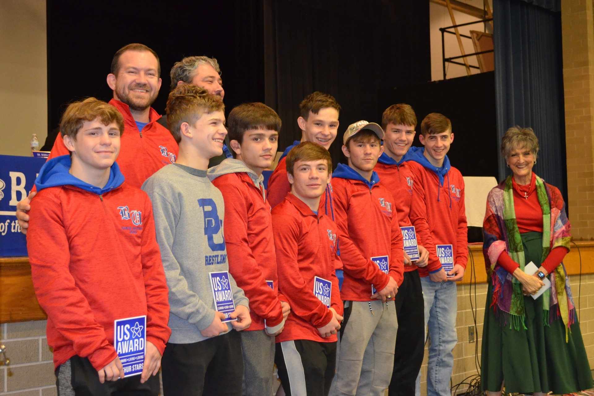 Upshur Stars are presented by Upshur County Schools Assistant Superintendent Dr. Debra Harrison to Buckhannon-Upshur High School wrestling state qualifiers and their coaches during Tuesday’s Upshur County Board of Education meeting held at the school. Qualifiers include Nathan Tyson, Ian Cornett, Liam Garcia, Aidan Wilson, Brodie Kennedy, Tucker Hurst, Andrew McDowell, Nathan Cornett, Luke Bohnsack, Trevor Randolph and Oscar Blonn. The B-UHS wrestling head coach is Jacob Orr and the assistant coaches are Levi Bender and Craig Wallace.