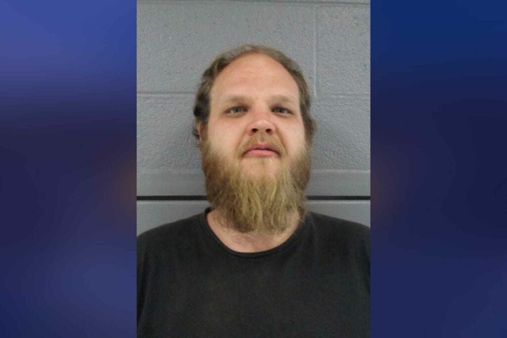 Rock Cave man arrested after allegedly hitting another man on the head with a hoe