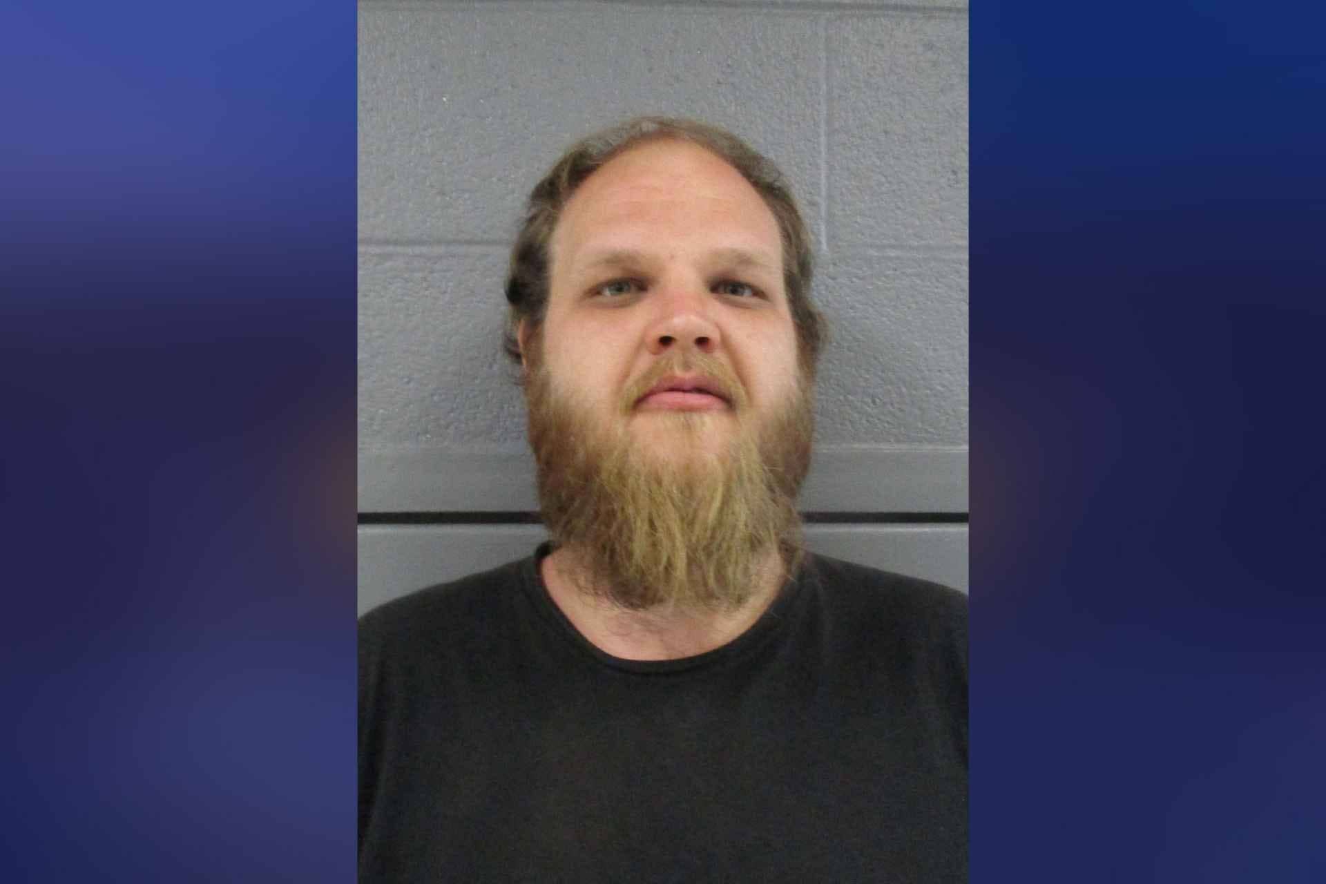 Rock Cave man arrested after allegedly hitting another man on the head with a picture
