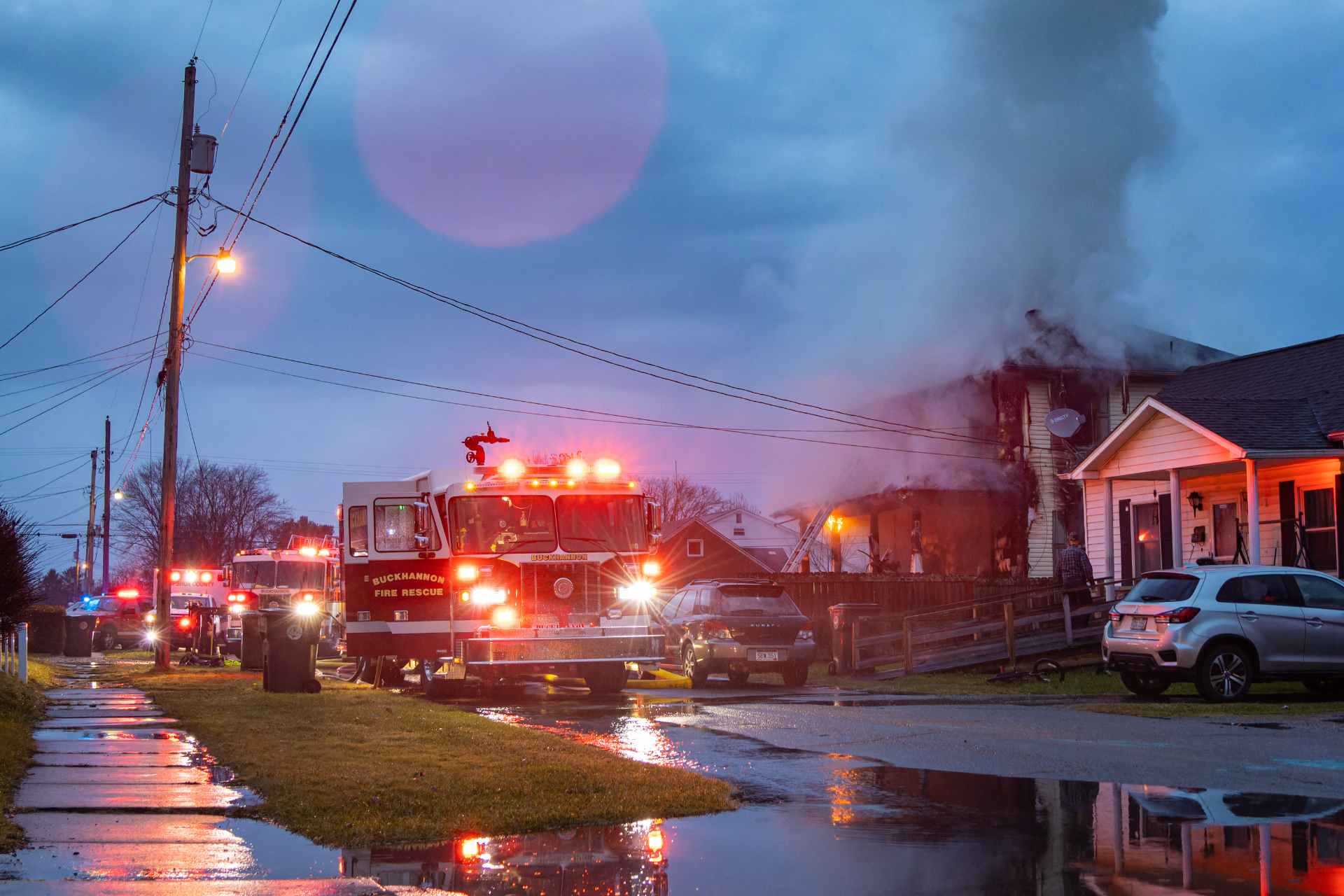Firefighters work to contain a fire that destroyed a home on Pocahontas Street early Sunday morning. (Photo by Brian Bergstrom/My Buckhannon)