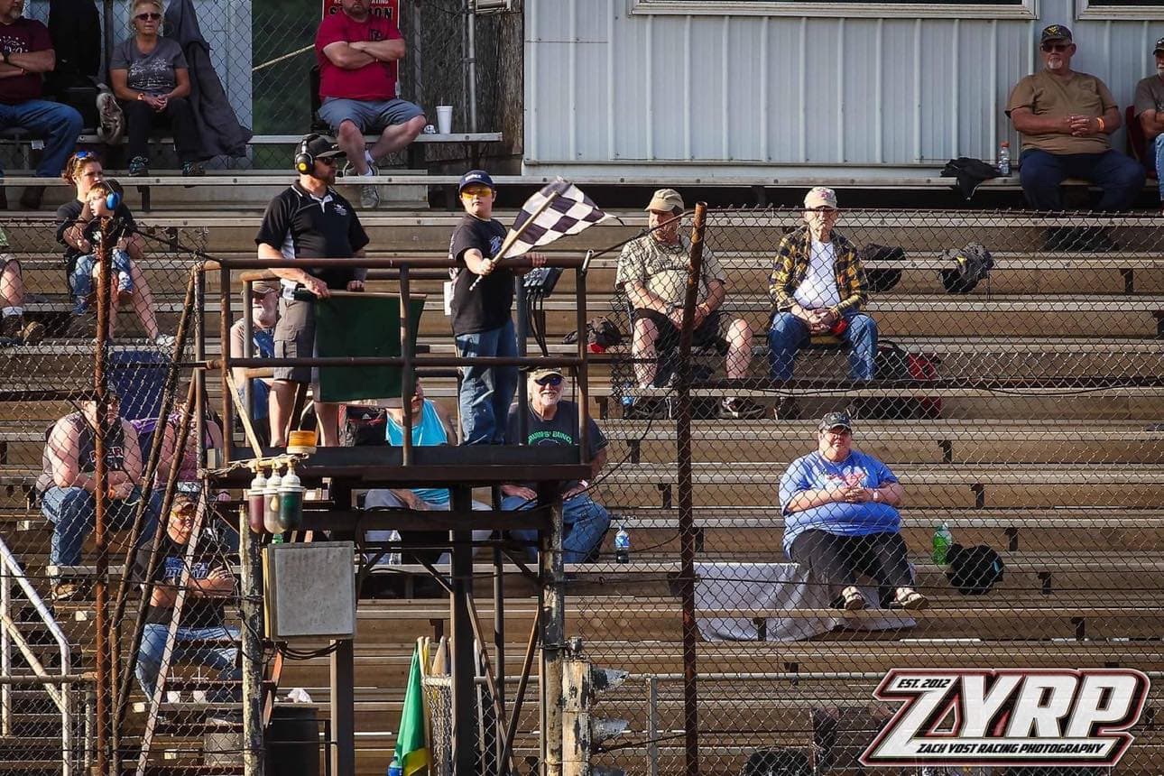 375019707_265130269678517_1881506114940224386_n Declan Carpenter flagging at Tyler County Speedway in Middlebourne, WV / Photo submitted by Patrick Carpenter