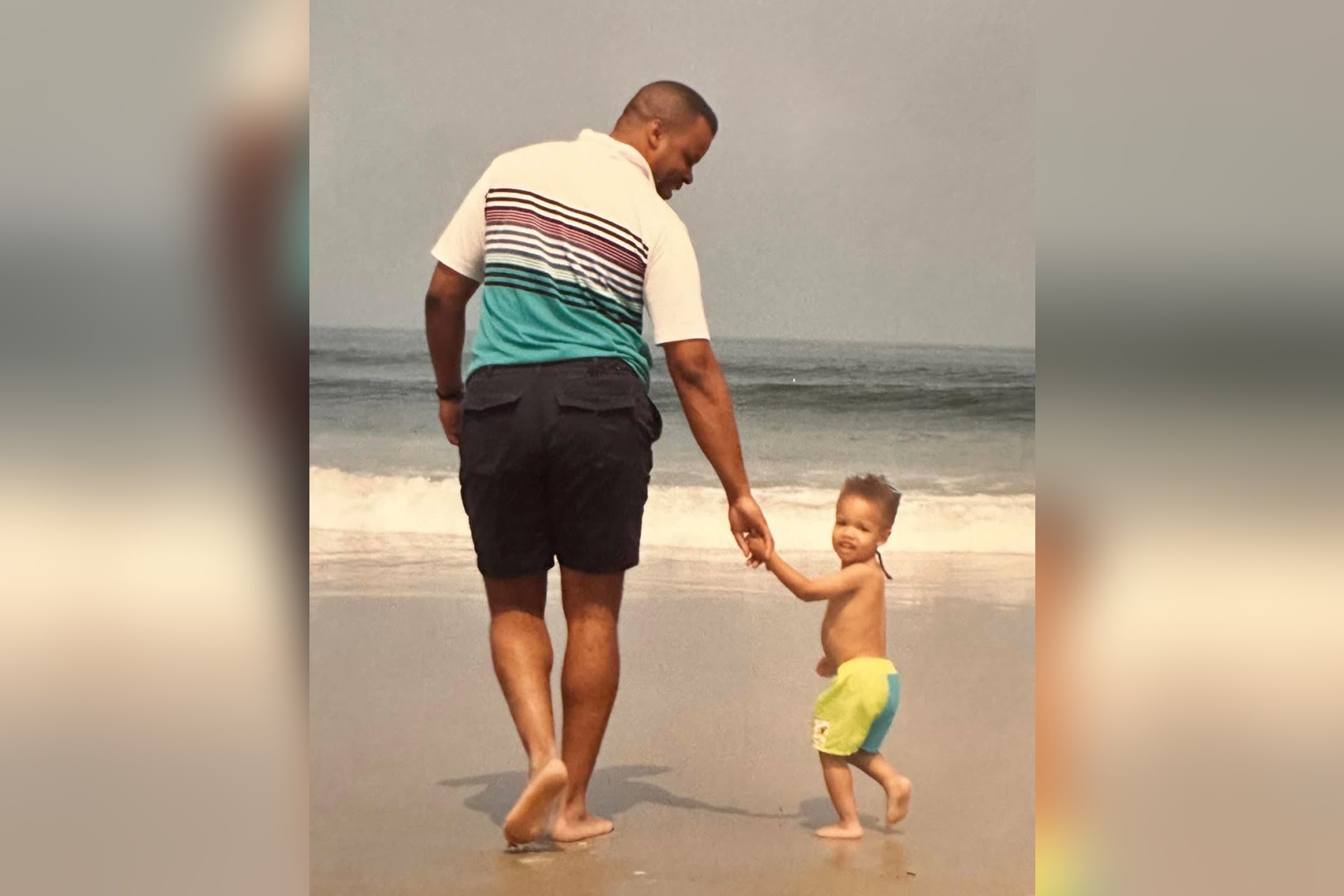 As a child, Chris Payne walks the beach with his father, Wilbert A. Payne, whose example of leadership and service helped shape his son's future.