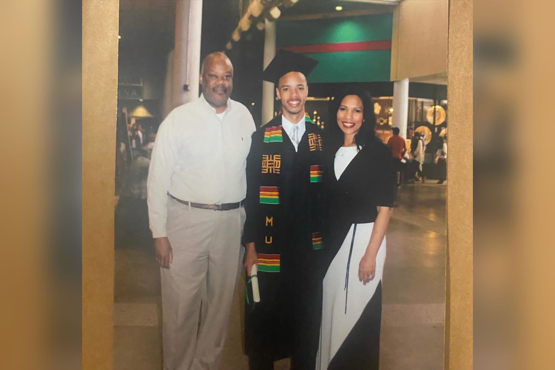 Chris Payne celebrates his undergraduate graduation with his parents, Wilbert A. Payne and Roslyn Clark Artis, both attorneys who helped inspire his path to law.