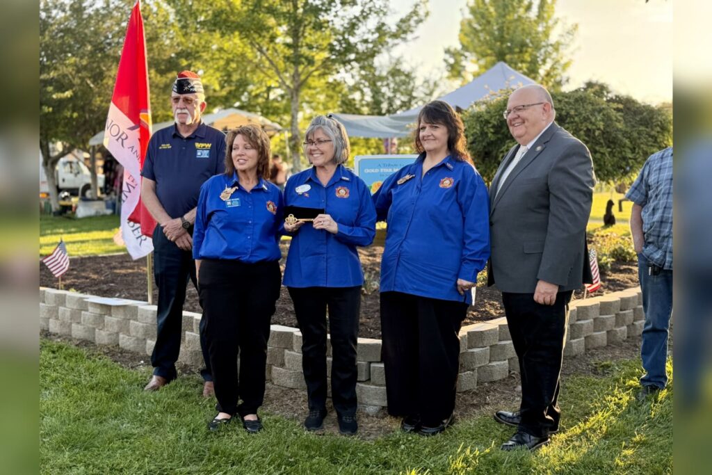 A VFW honor guard joined Auxiliary members and Recorder Randy Sanders, right, at the ceremony in Jawbone Park.