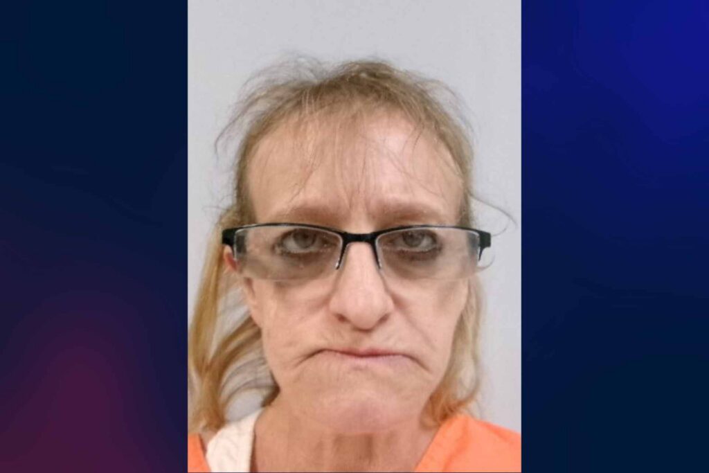 Woman arrested after allegedly striking man with metal pipe, threatening him