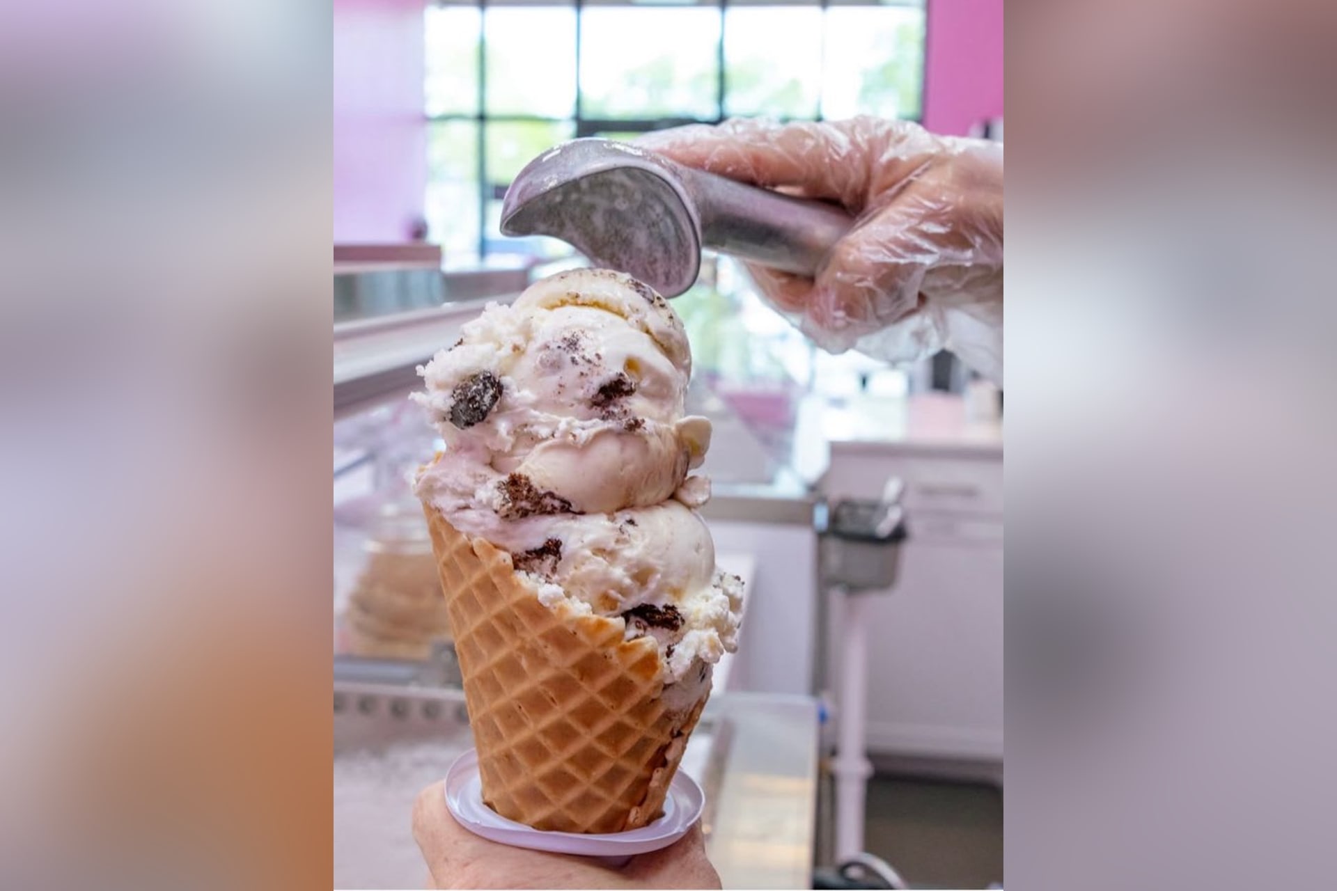 Ice cream being scooped in a cone