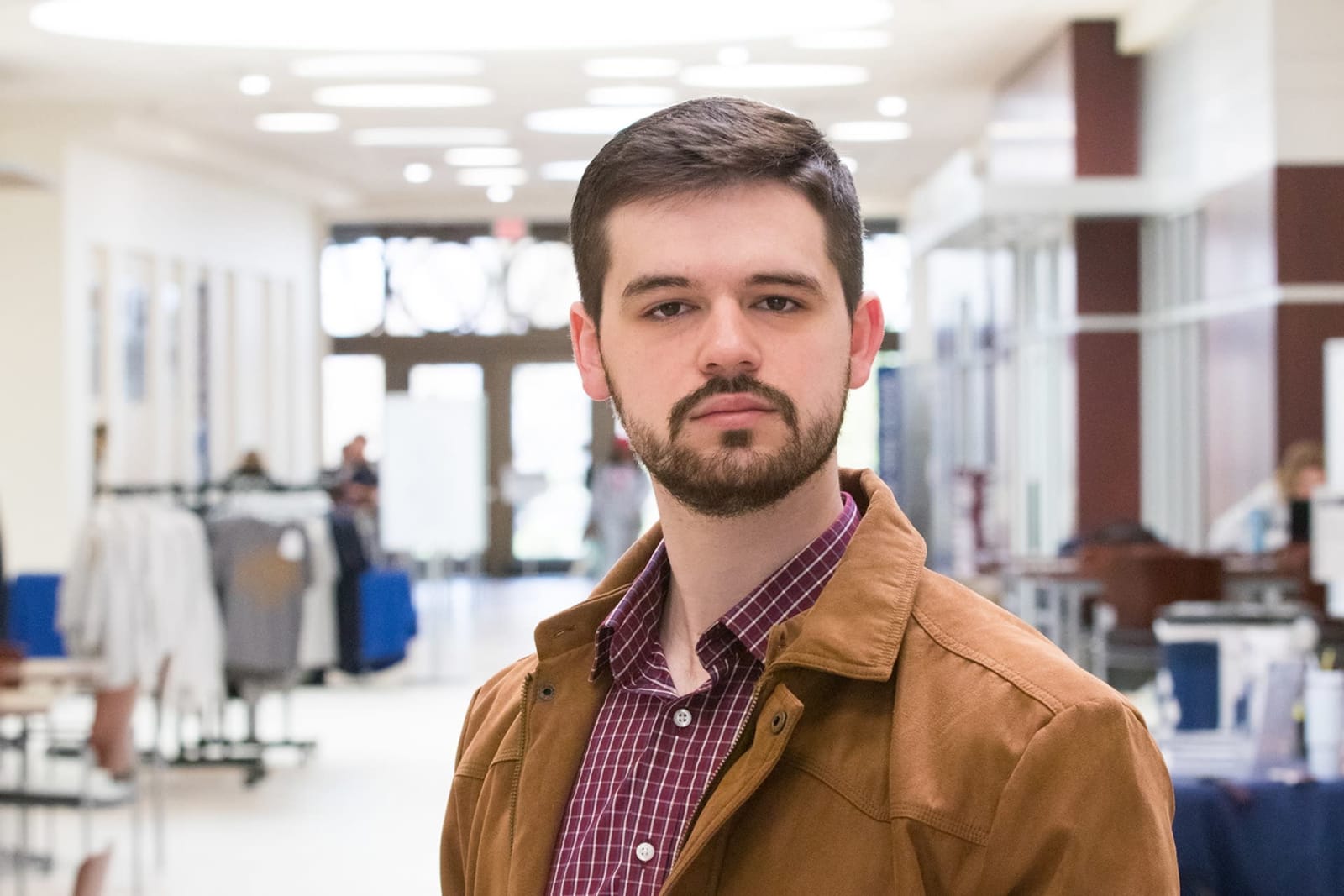 WVU Law student Grant Joynes stands in the law school atrium