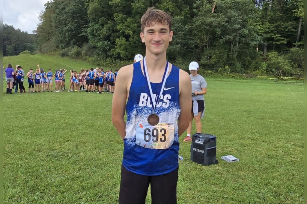 X-C Bucs battle weather, storm to runner‑up finish at home invitational
