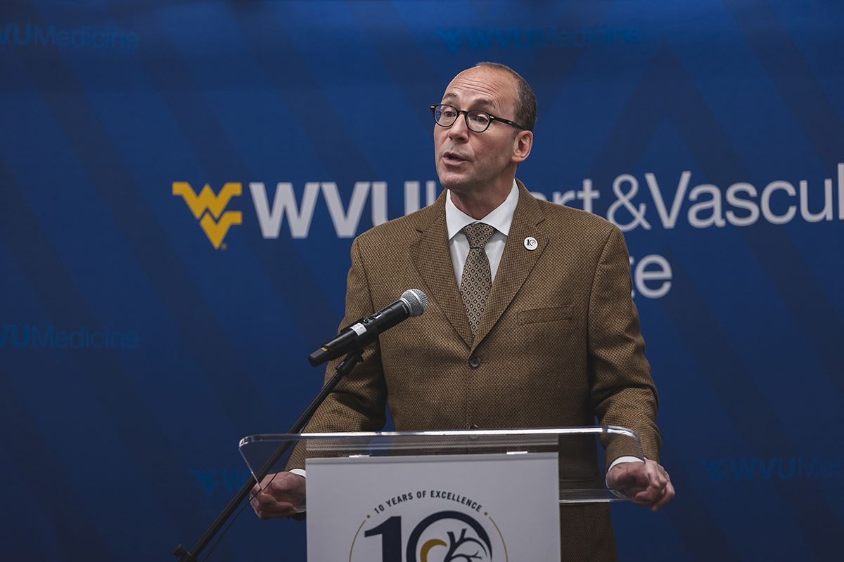 Albert L. Wright Jr. speaks at a podium during the WVU Heart and Vascular Institute's 10th anniversary celebration